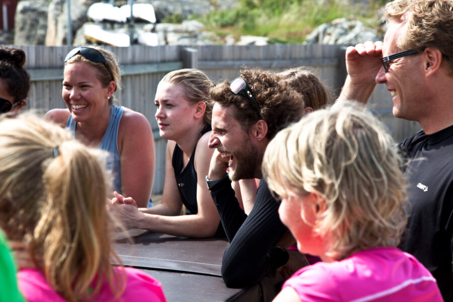 a group of happy people taking part in an outdoor competition