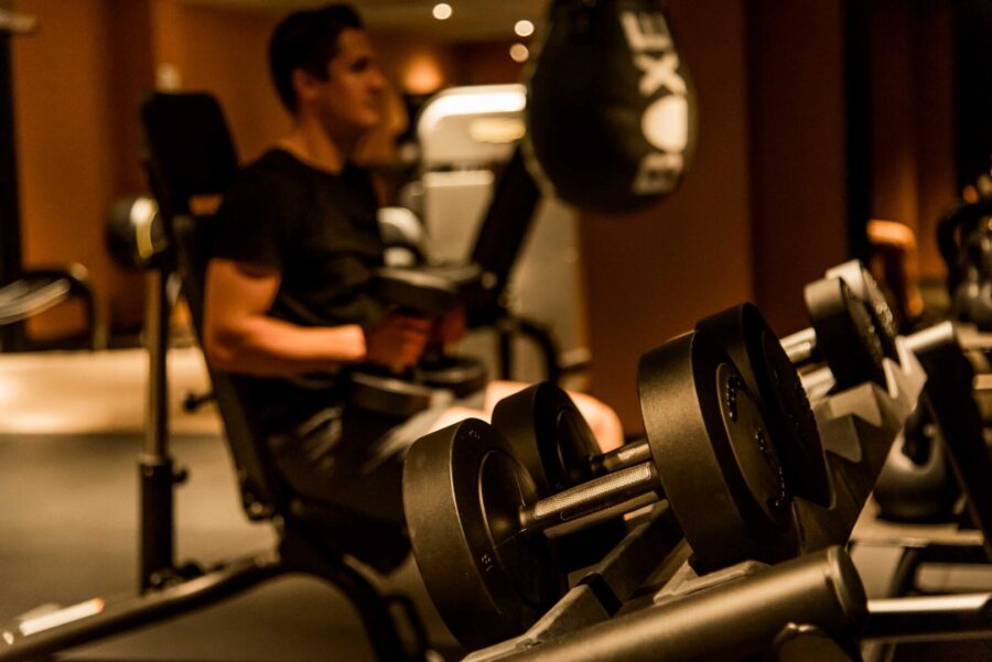 man in machine at gym