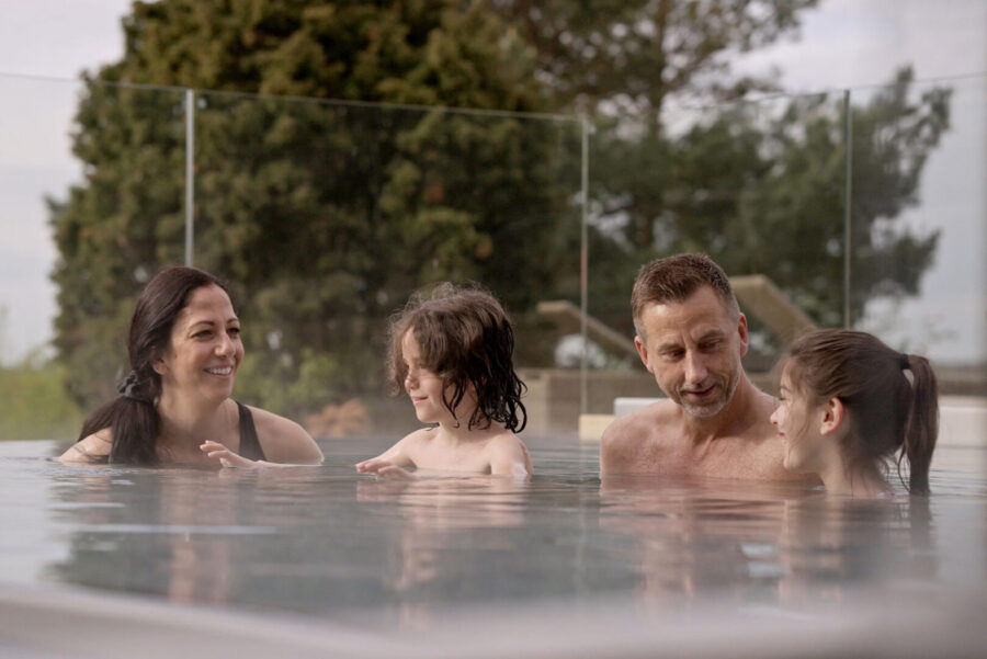 a family in an outdoor pool